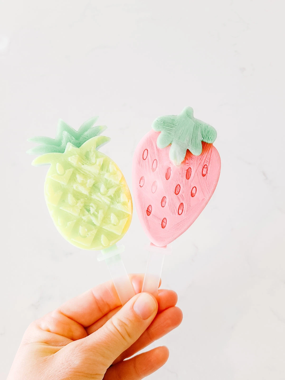 popsicle molds made from silicone in dinosaur and fruit shape
